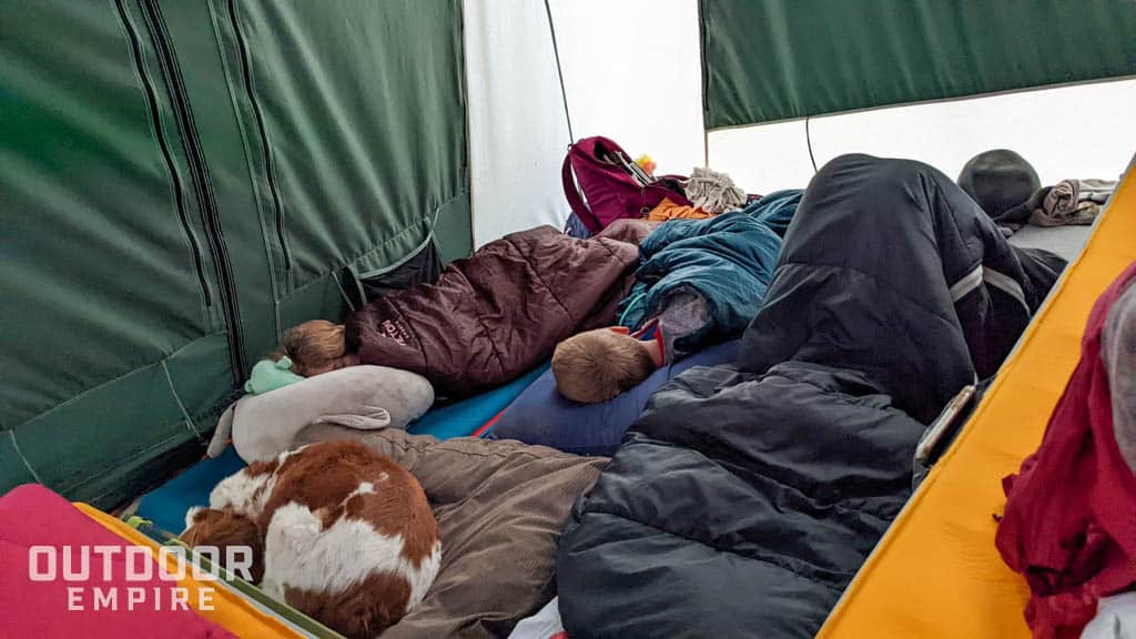 Campers sleeping in white duck prota tent