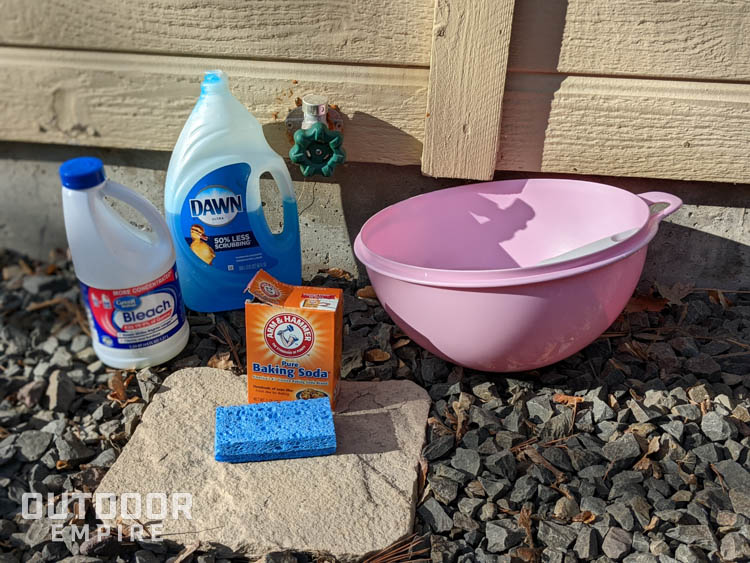 Mold cleaning supples by outdoor spigot