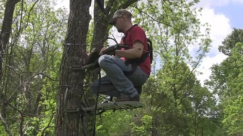 Hunter assembling tree stand