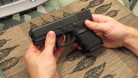 Man holding glock 20