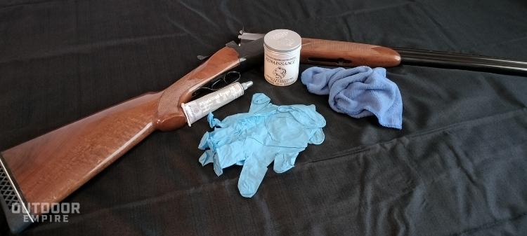 shotgun, wax, soft cloth and gloves