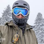 Skier with bca bc link radio lapel mic clipped on front of ski jacket