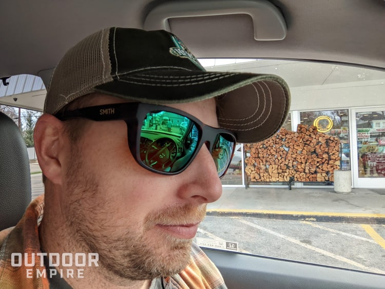 Man wearing smith barra sunglasses in car with hat on