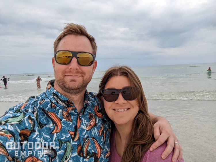 Couple wearing sunglasses on beach